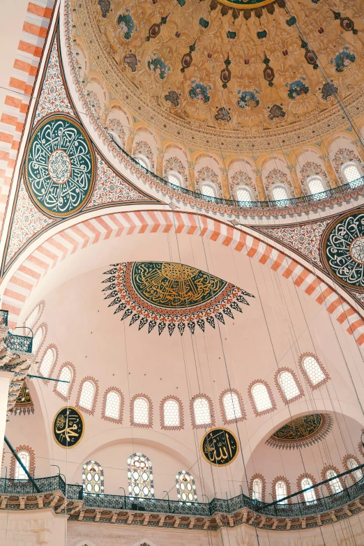 two ornate ceiling tiles and decorative designs in a large building