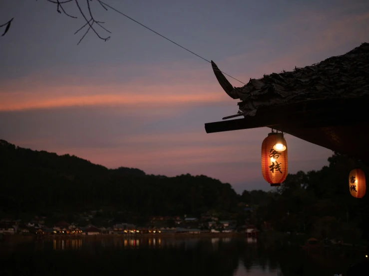 an image of lantern hanging in the air at dusk