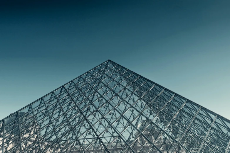 the pyramid is an interesting structure in front of blue sky