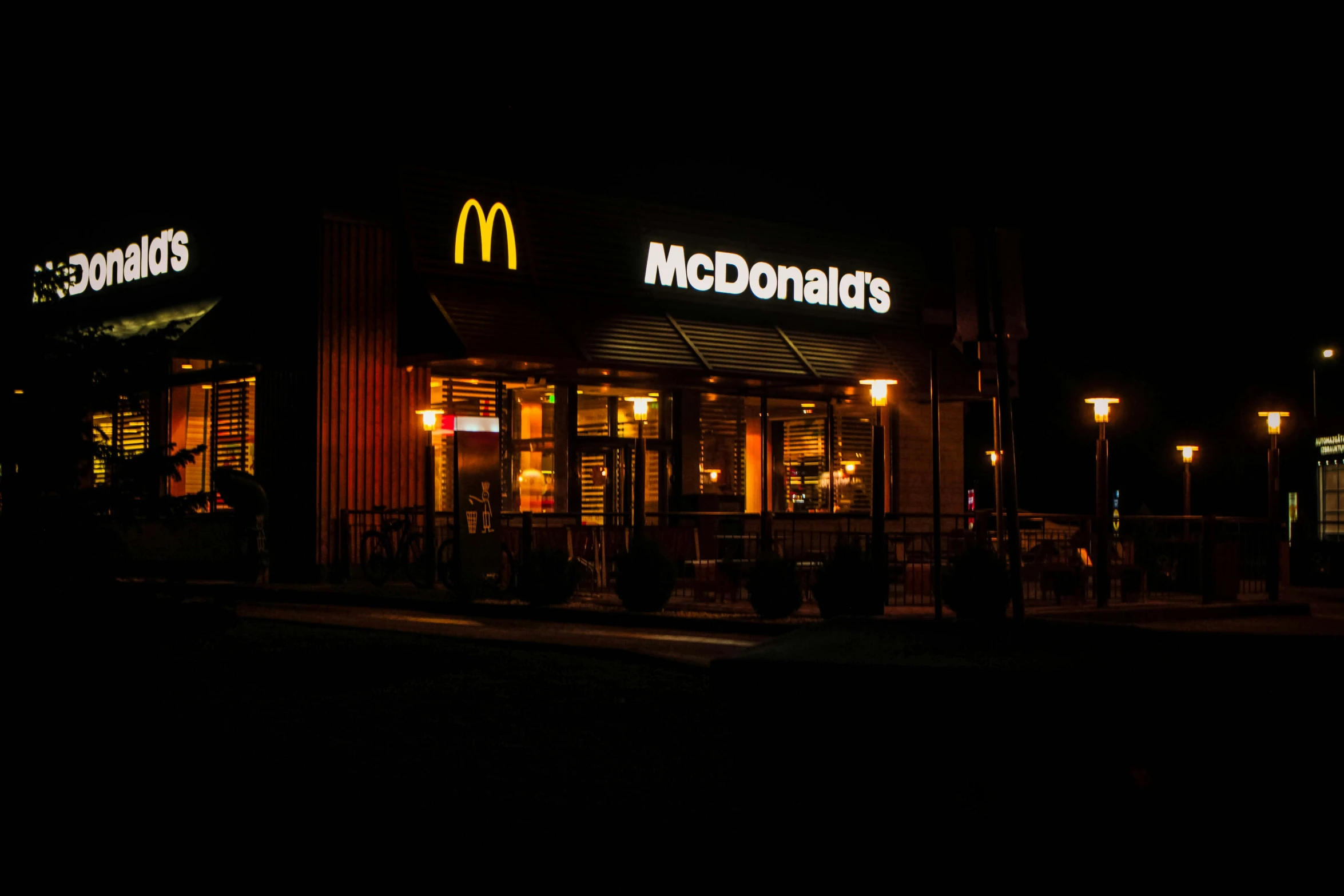 the front of a restaurant lit up at night