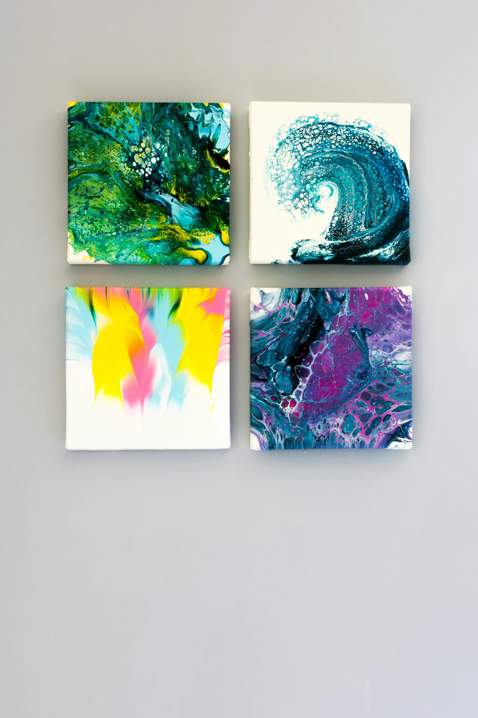 four paintings are arranged on top of each other