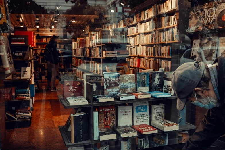 there are several books sitting on shelves in the store