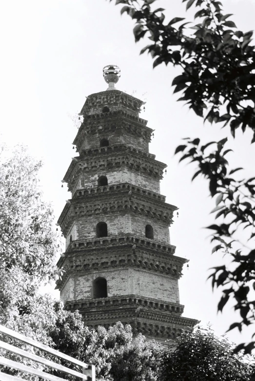 a large pagoda is sitting near the trees