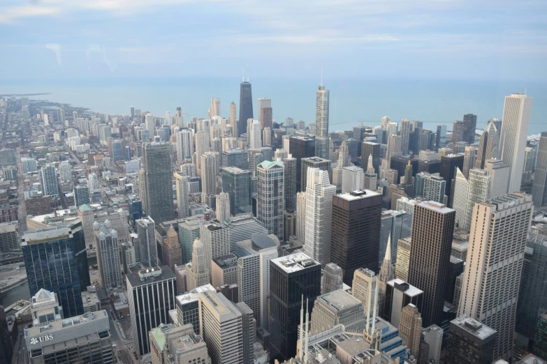 an aerial view of skyscrs in the middle of city