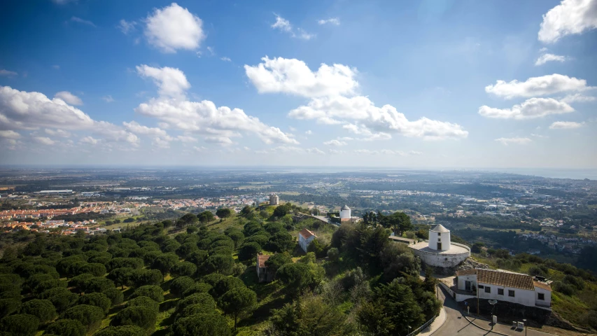 a bird's eye view of a rural area in the distance