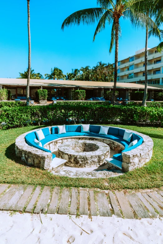 the fire pit has been built on the grass and stones