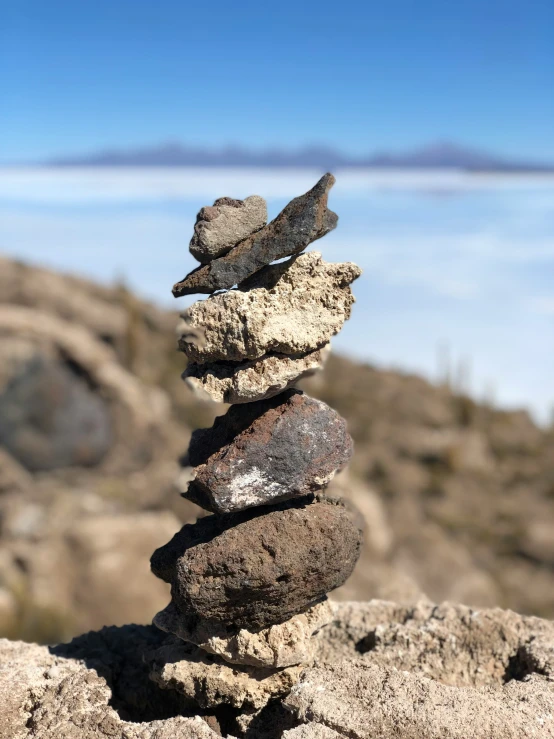 a stack of rocks sitting on top of a cliff