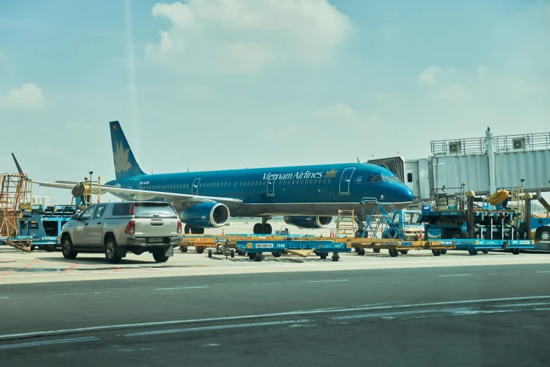 a large jetliner sitting on top of an airport tarmac