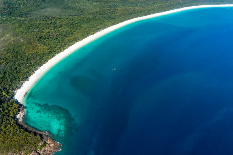 an aerial view of the water and land