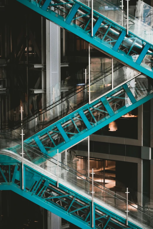 a group of escalators that are above other buildings