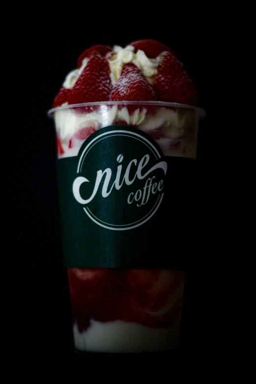 a close up of a coffee cup with berries