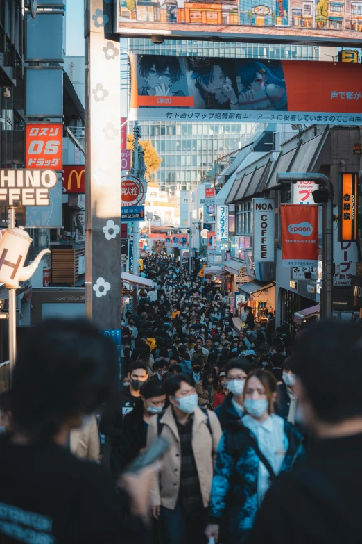 a group of people with masks on and one person walking down the street