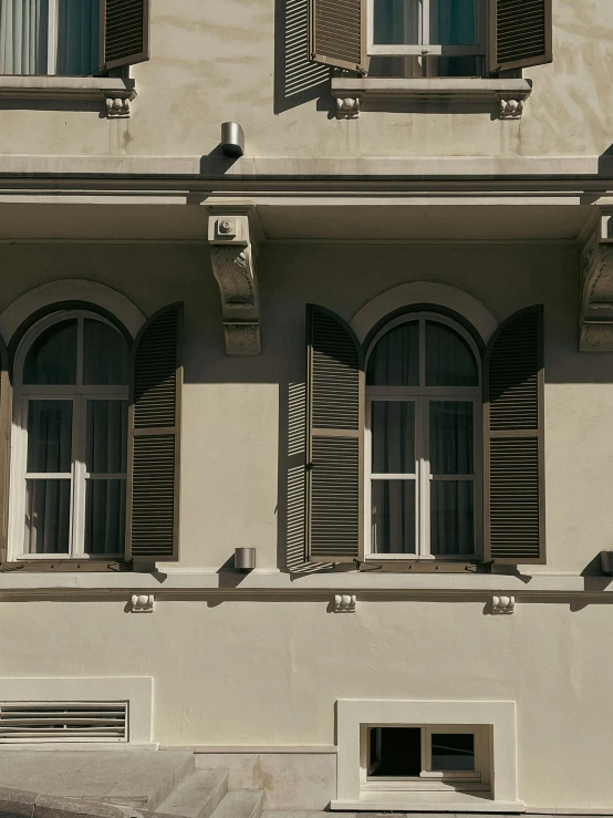 a building with some large window panes on the side