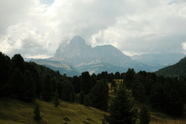 a scenic view of some mountains, trees and other things