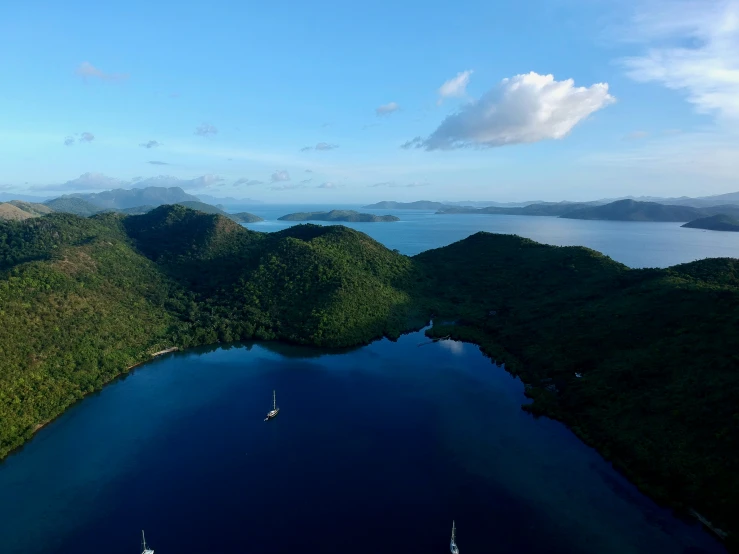 a boat floats on a body of water