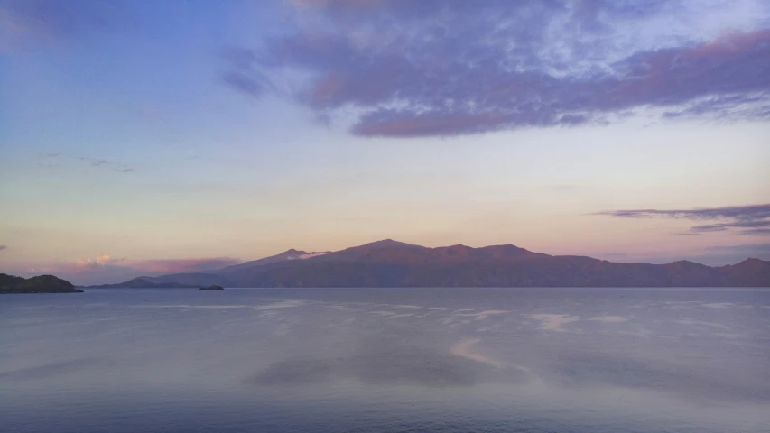 a view of some mountains from the water