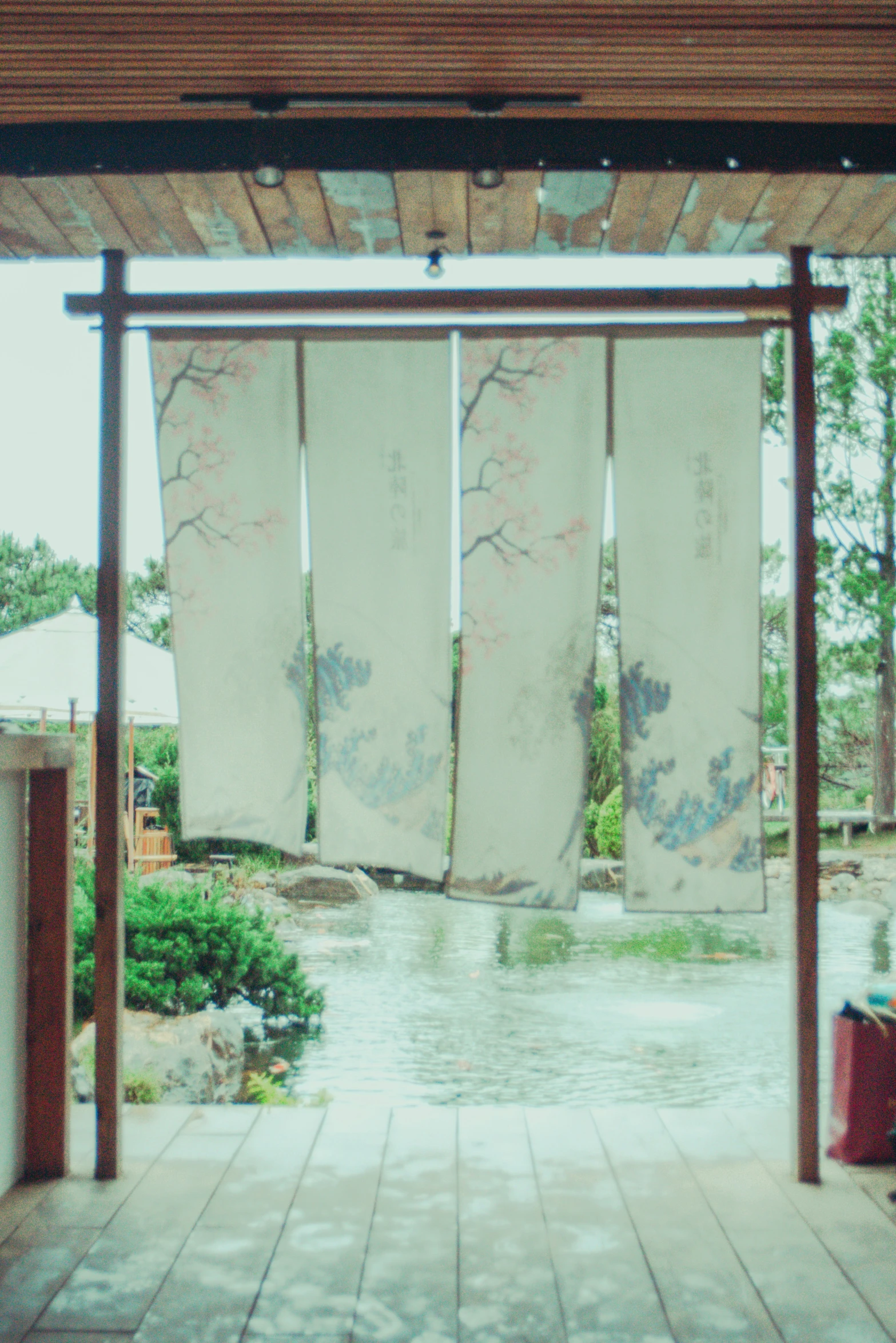 an open room with curtains over a doorway