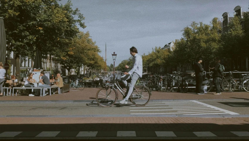 an individual riding a bike in the middle of a city