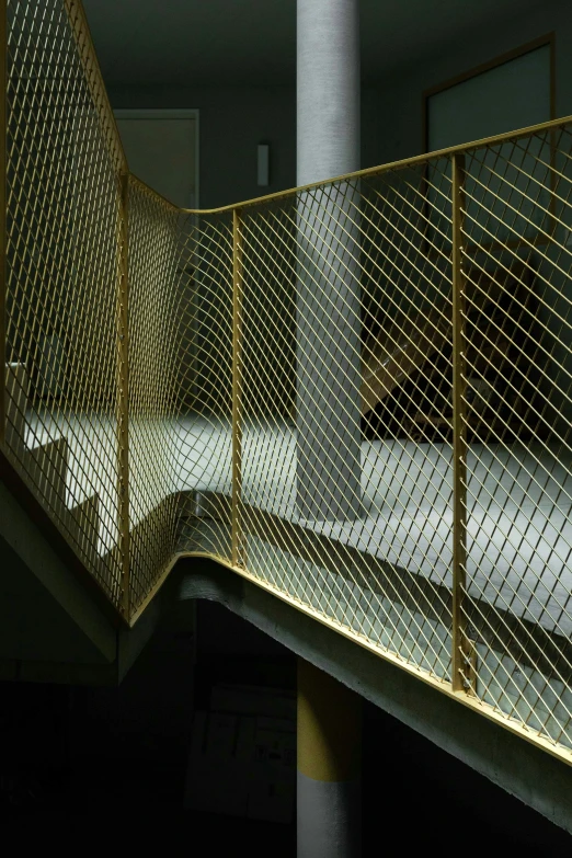 a man walking across a metal fence on top of stairs