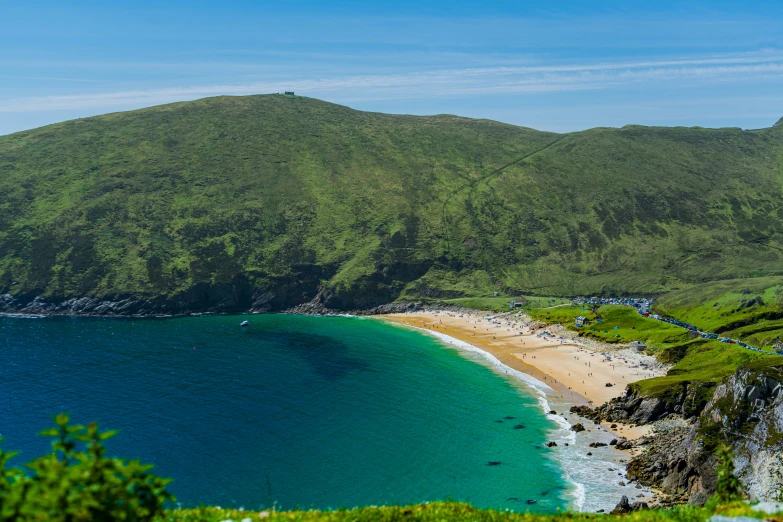 the view of a beach with people swimming