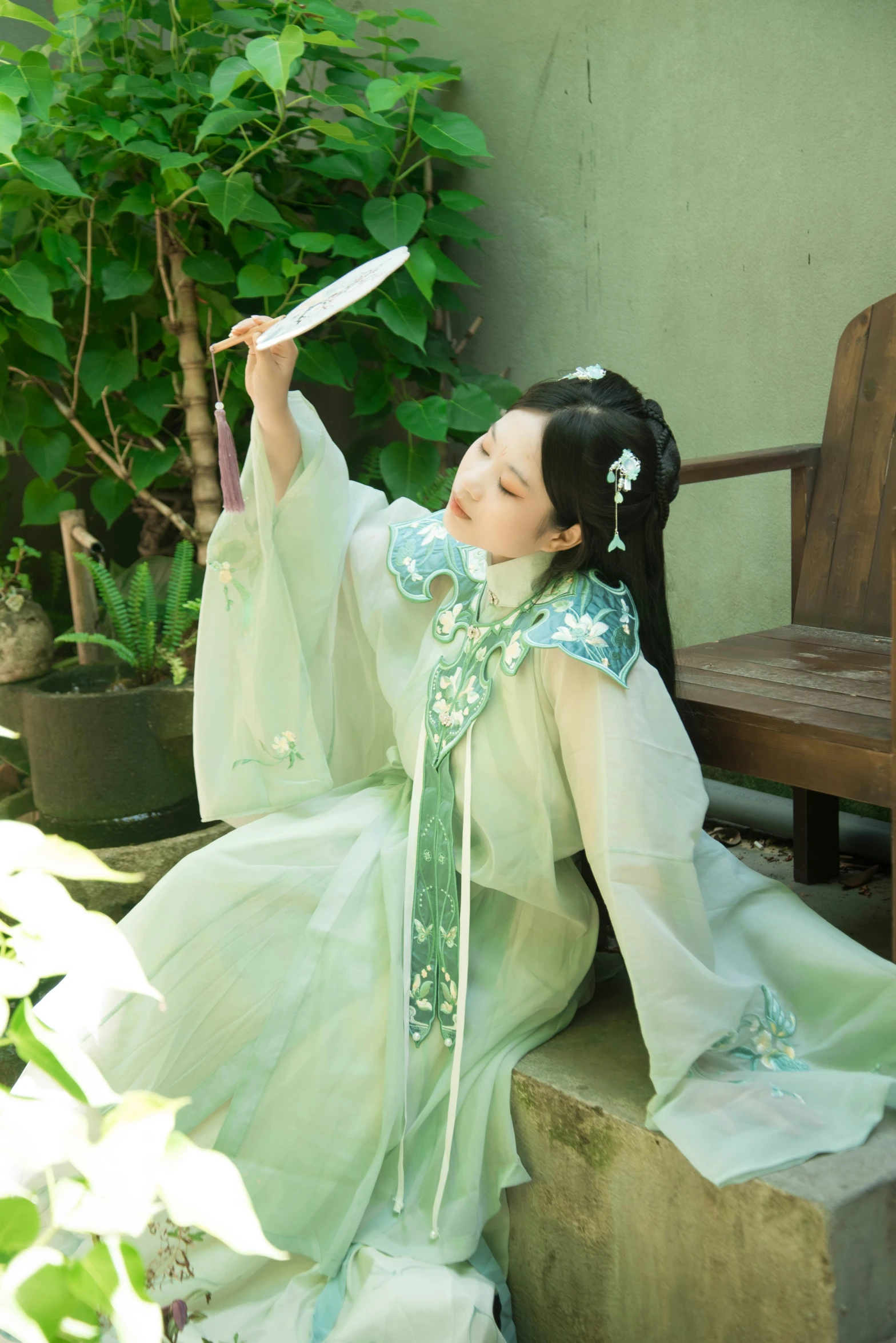 a girl is dressed in a traditional japanese costume