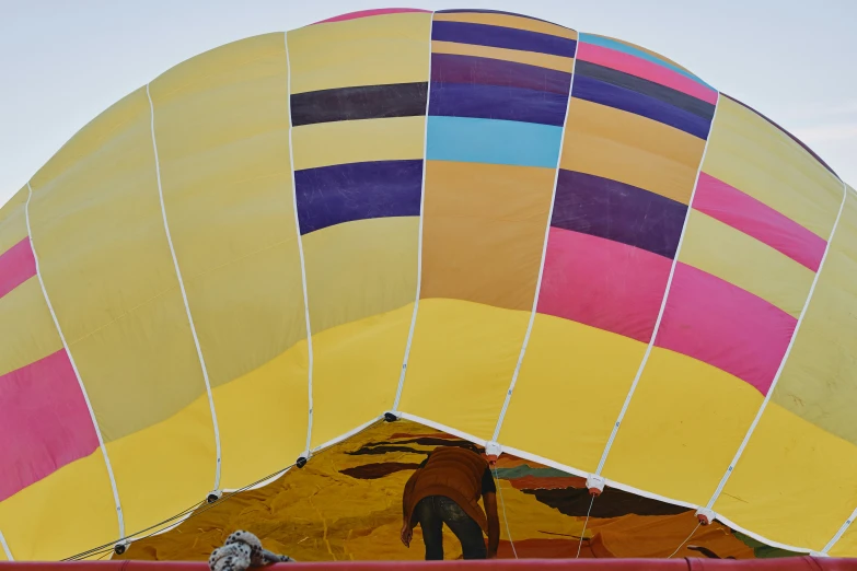 a couple of large  air balloons with people inside