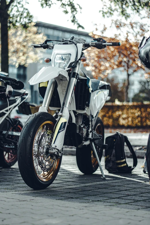 the motorcyclist is wearing all black and white