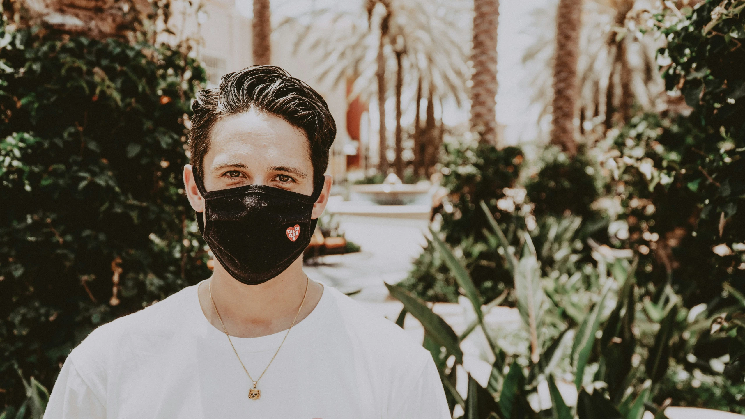 a man in a mask standing outside