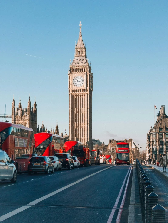 a big tower with a clock on top in the city