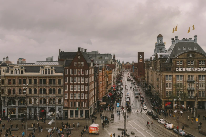 a cityscape with buildings and people in the street