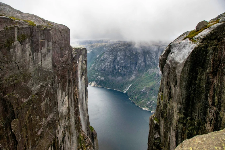 the view of a mountain with a large body of water