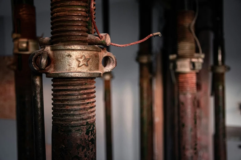 an up close view of rusted metal pipes in a factory