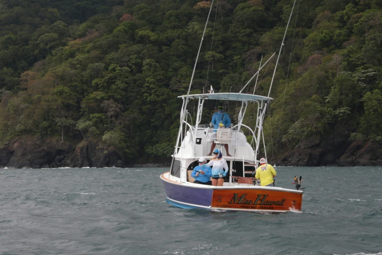 a fishing boat is sailing in the water