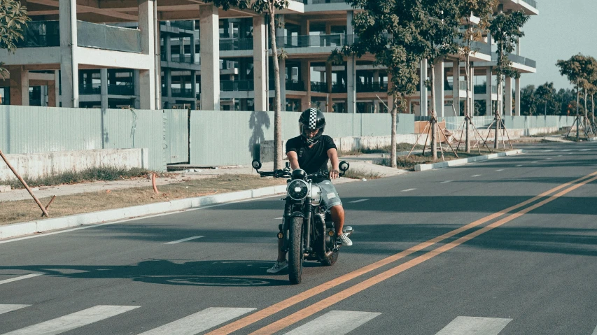 a person riding a motorcycle on the road