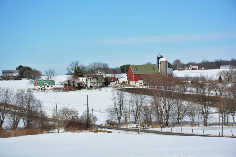 a snow covered field that is very scenic