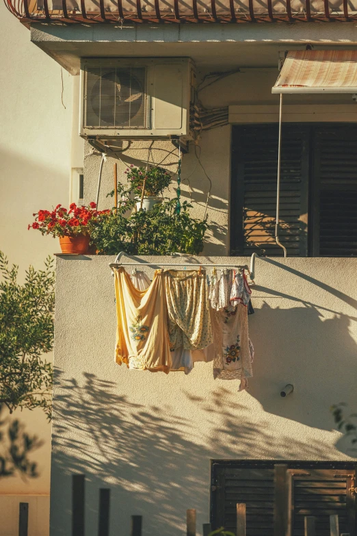 clothes hung on the windows of the old buildings