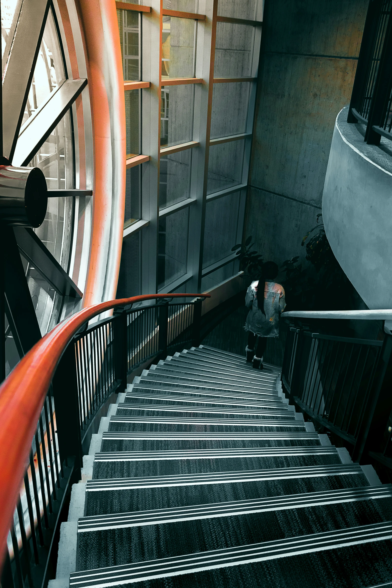 a stair case and a clock in a building