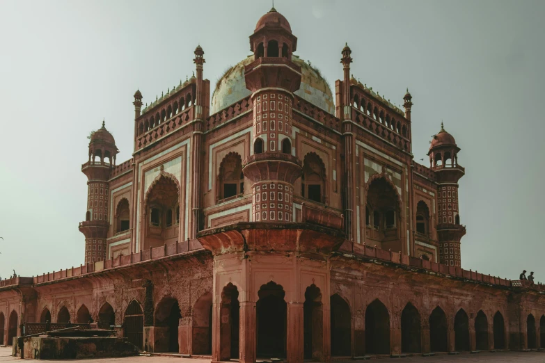 the large building has two towers and several arches