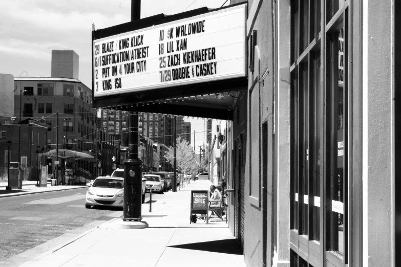 there is a theater sign in black and white