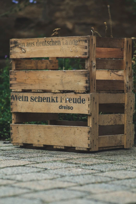 a wooden crate with some sort of sign on it