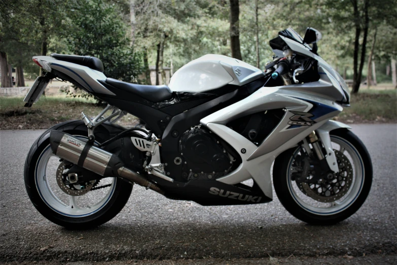 a modern motorcycle is parked on the street