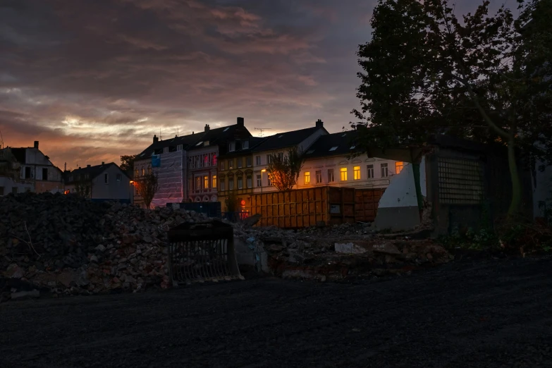 a building next to a street that is covered in rubble