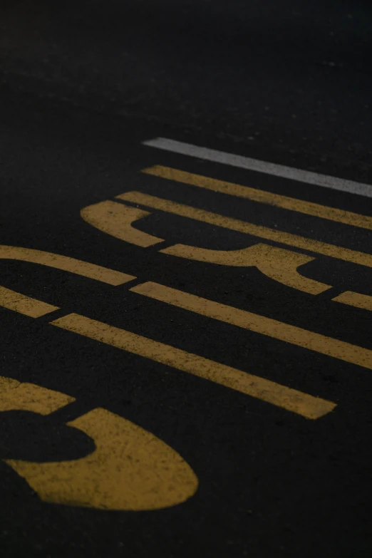 an image of a black and yellow painted on the ground