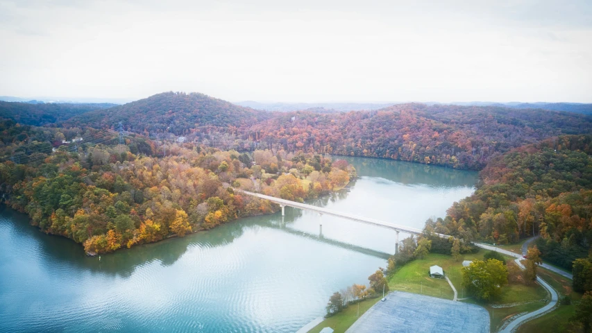 aerial view of a mountain lake and a bridge
