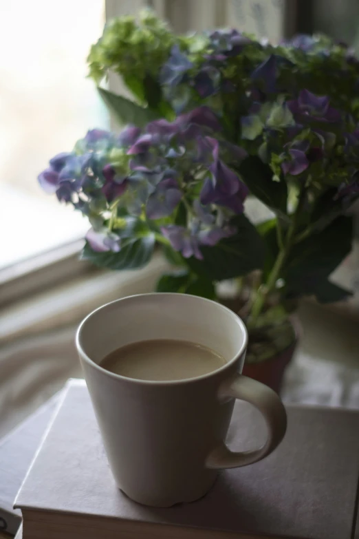 a cup of coffee on top of a table