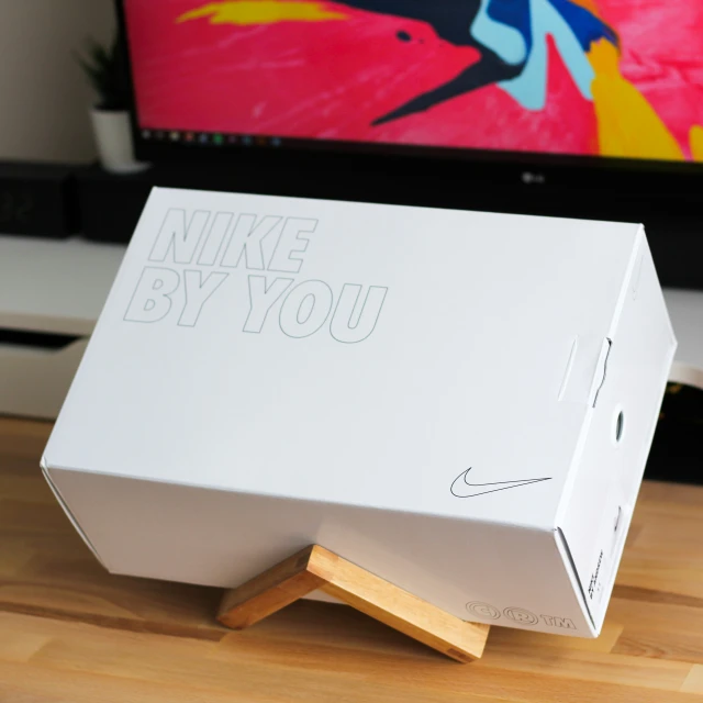 an open box for a computer that reads nike by you