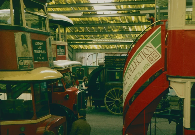 antique trolley cars are displayed in a museum