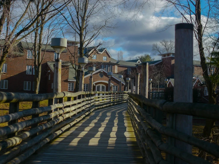 the pedestrian is crossing the bridge in the village