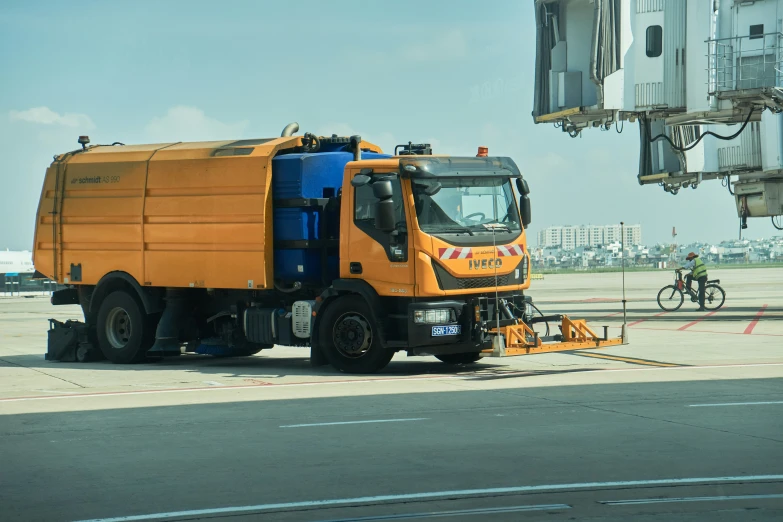 a truck with a large trailer on a runway