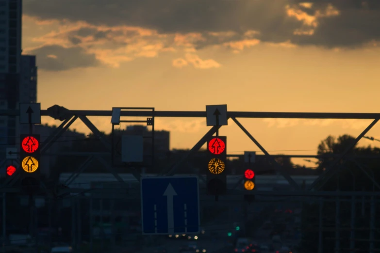 two red yellow and green stop lights and traffic signs